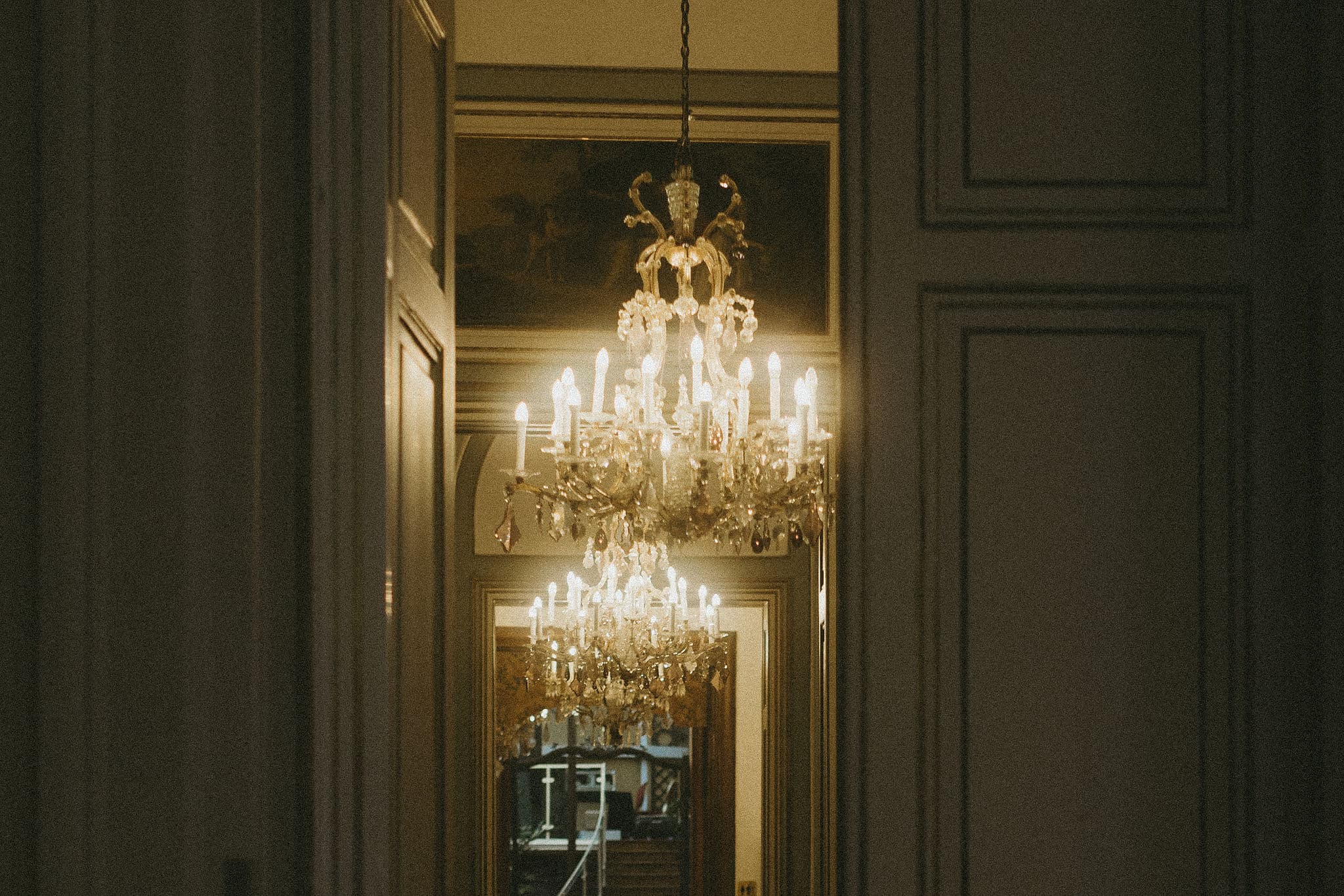 Crystal chandeliers seen through the enfilade of salons at Palais Auersperg